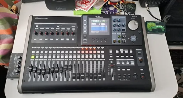 Chris Garth working at mixing desk in home recording studio