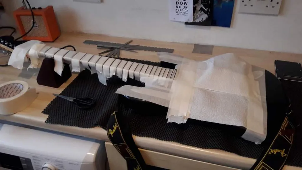 Guitar neck fretboard cleanup